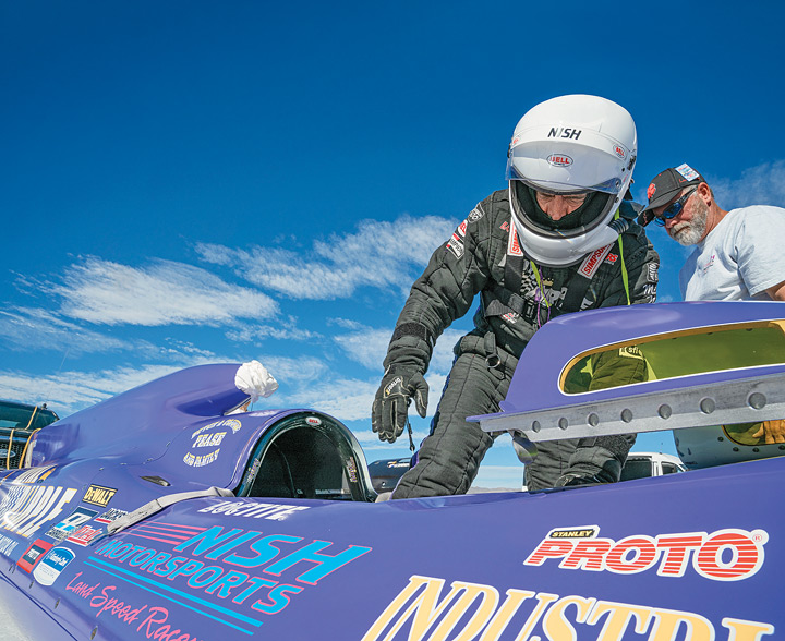 Mike Nish of Salt Lake City enters the cockpit of “Royal Purple” streamliner after a two-year hiatus from racing since the death of his father and patriarch of the Nish Motorsports team, Terry Nish. 