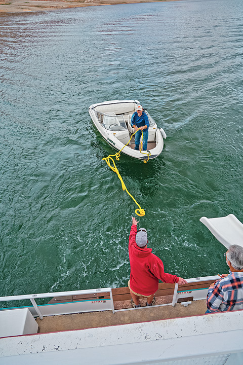Younger members of the brothers’ spring trip use a fishing boat for side excursions. 