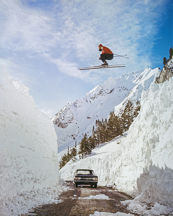 Alf Engen launches off an avalanche to jump over a road. Photo by J. Willard Marriott Library